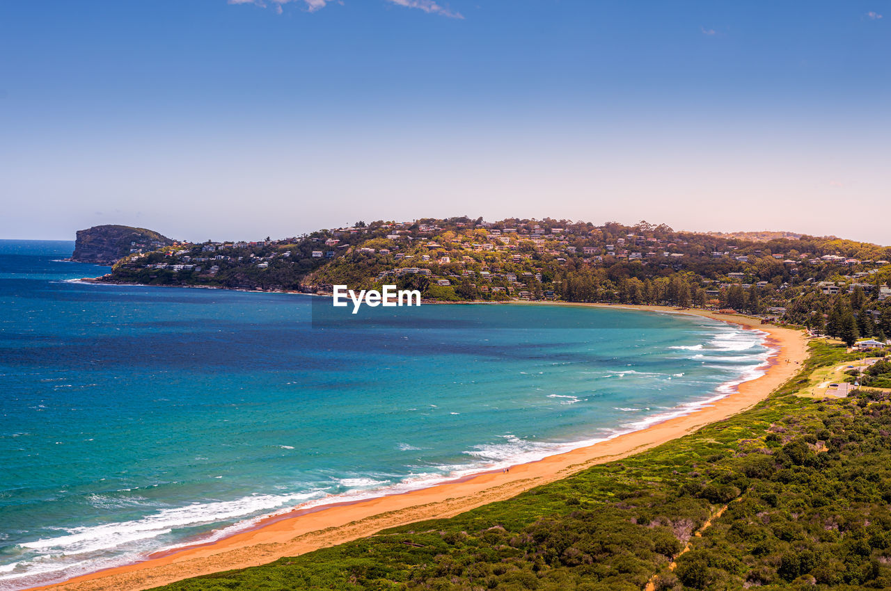 Scenic view of sea against clear blue sky