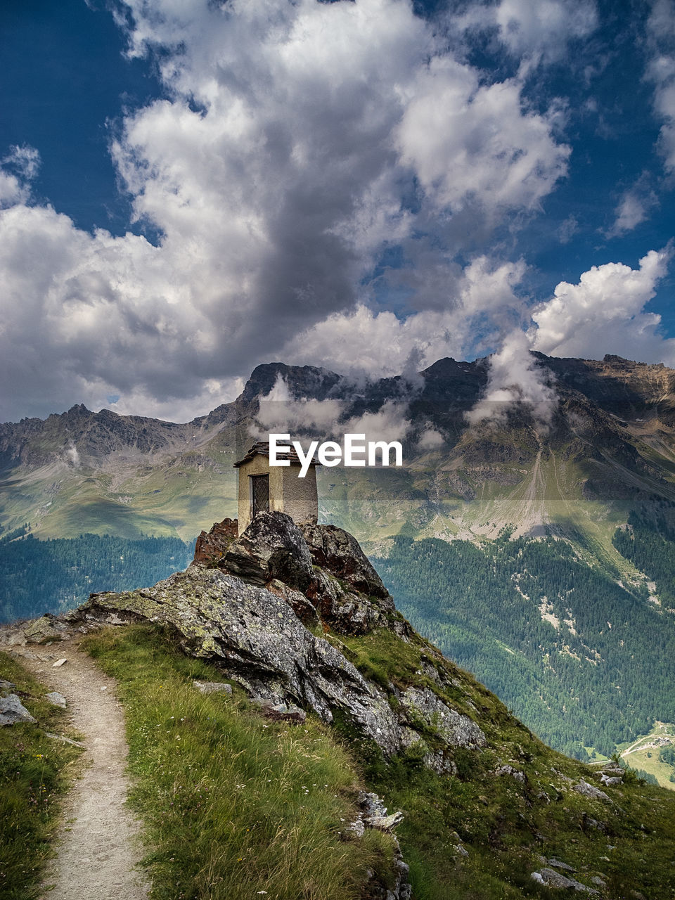 Built structure on mountain against sky