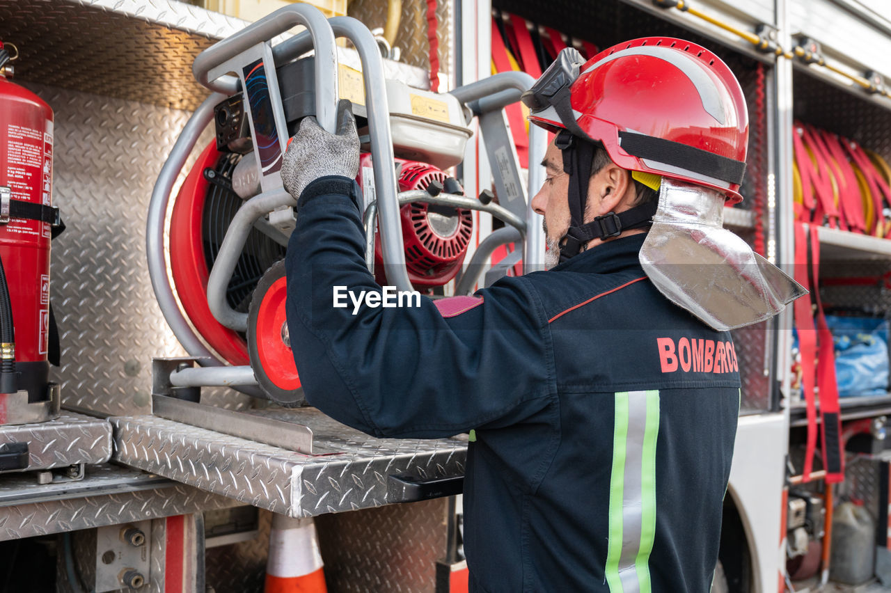 rear view of man working at construction site