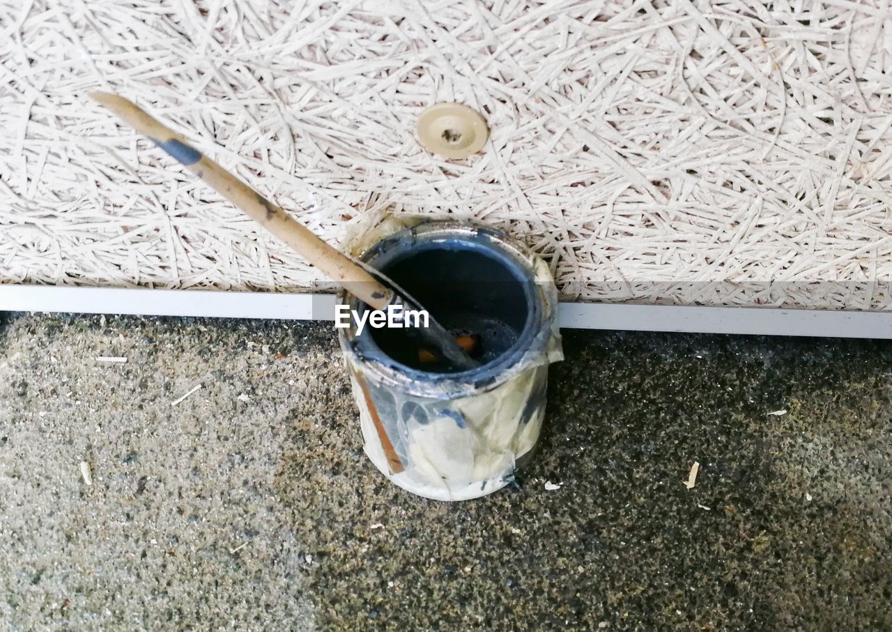 HIGH ANGLE VIEW OF COFFEE CUP WITH SPOON