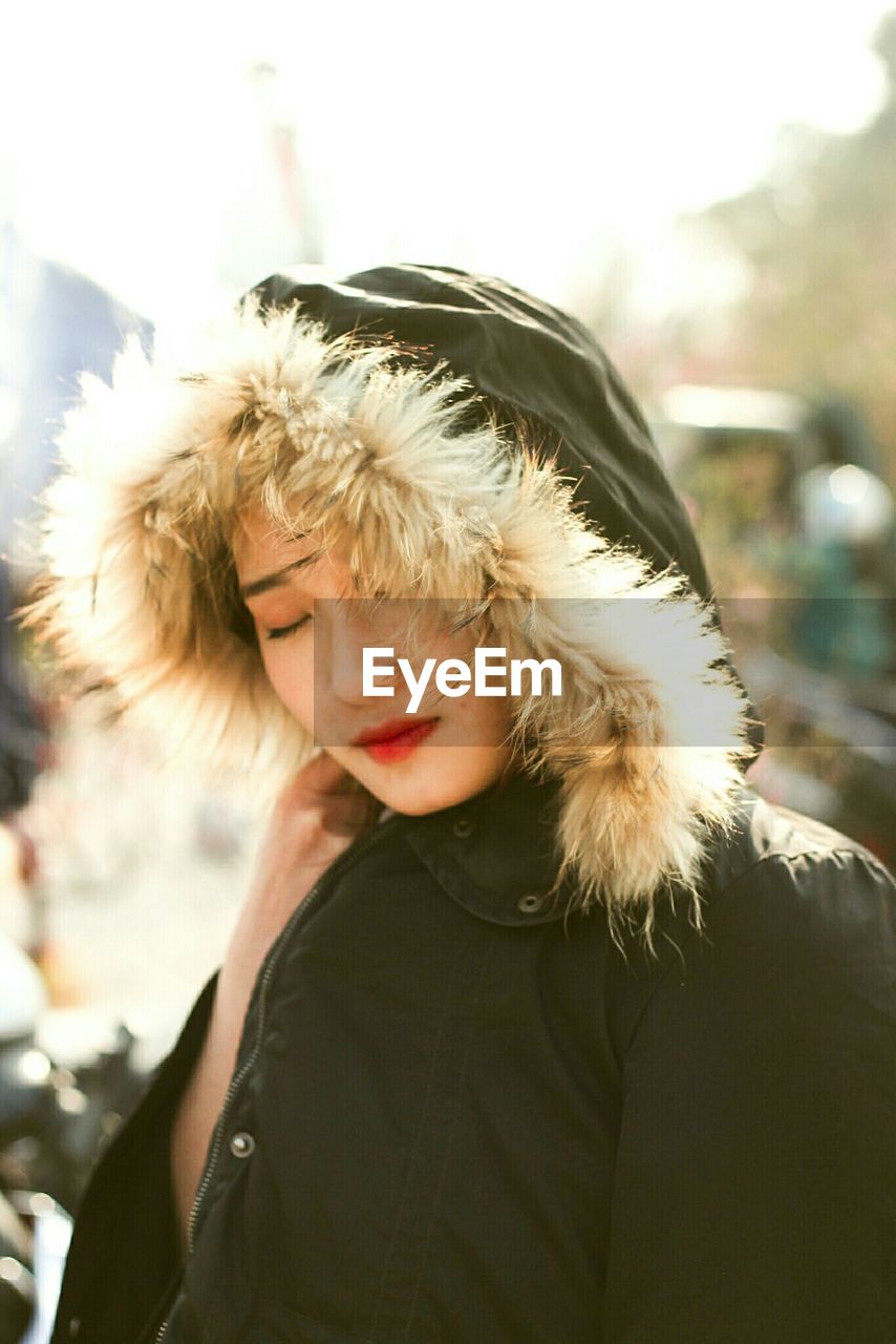 Close-up of woman wearing hooded jacket