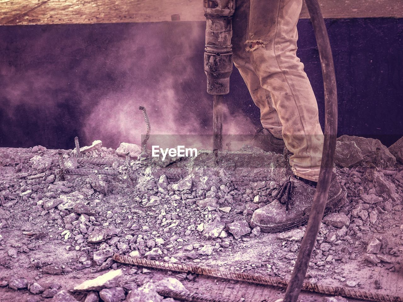 Low section of man working at construction site