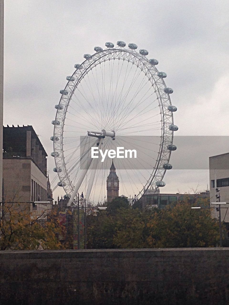 LOW ANGLE VIEW OF FERRIS WHEEL AGAINST SKY