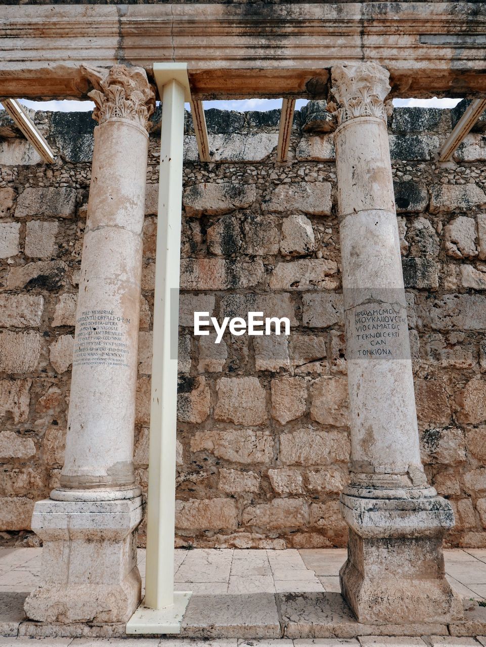 LOW ANGLE VIEW OF OLD BUILDING AGAINST WALL