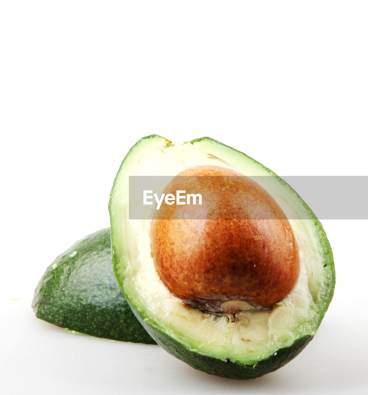 CLOSE-UP OF LEMON ON WHITE BACKGROUND