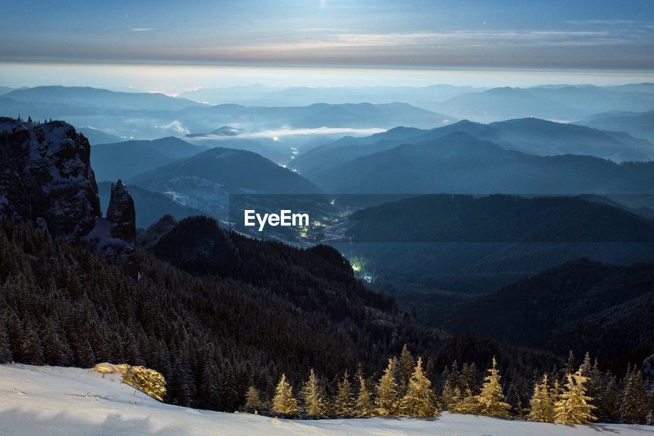 Scenic view of snowcapped mountains against sky