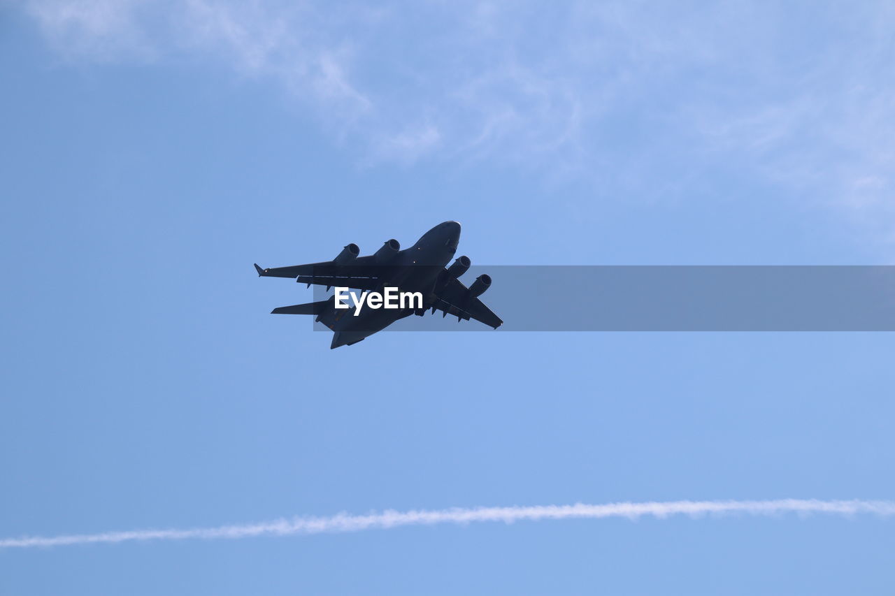 LOW ANGLE VIEW OF AIRPLANE AGAINST SKY