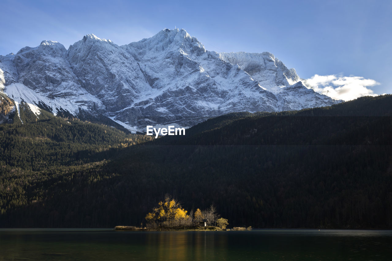 scenic view of snowcapped mountains against sky during winter