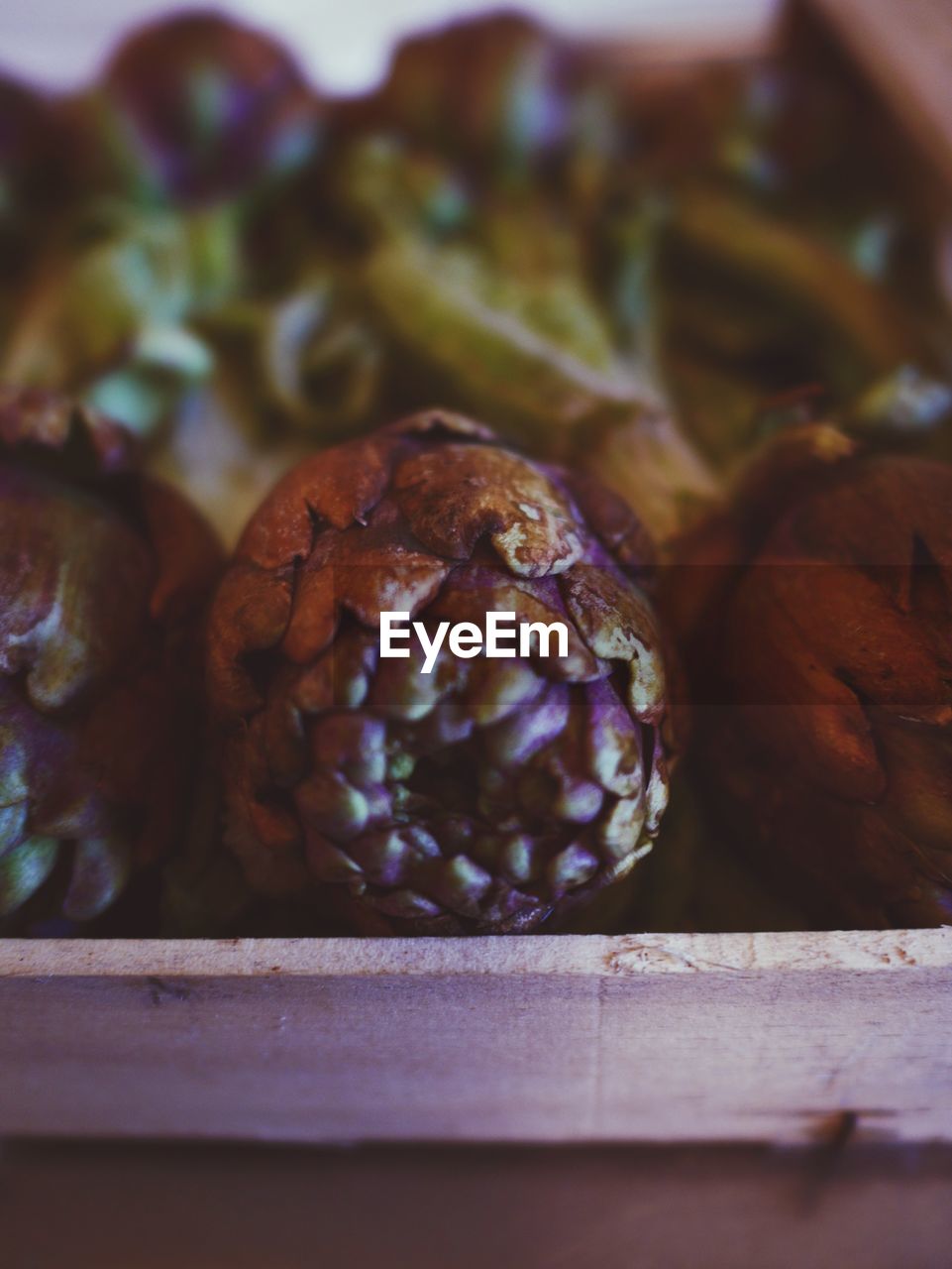 Close-up of artichokes in container