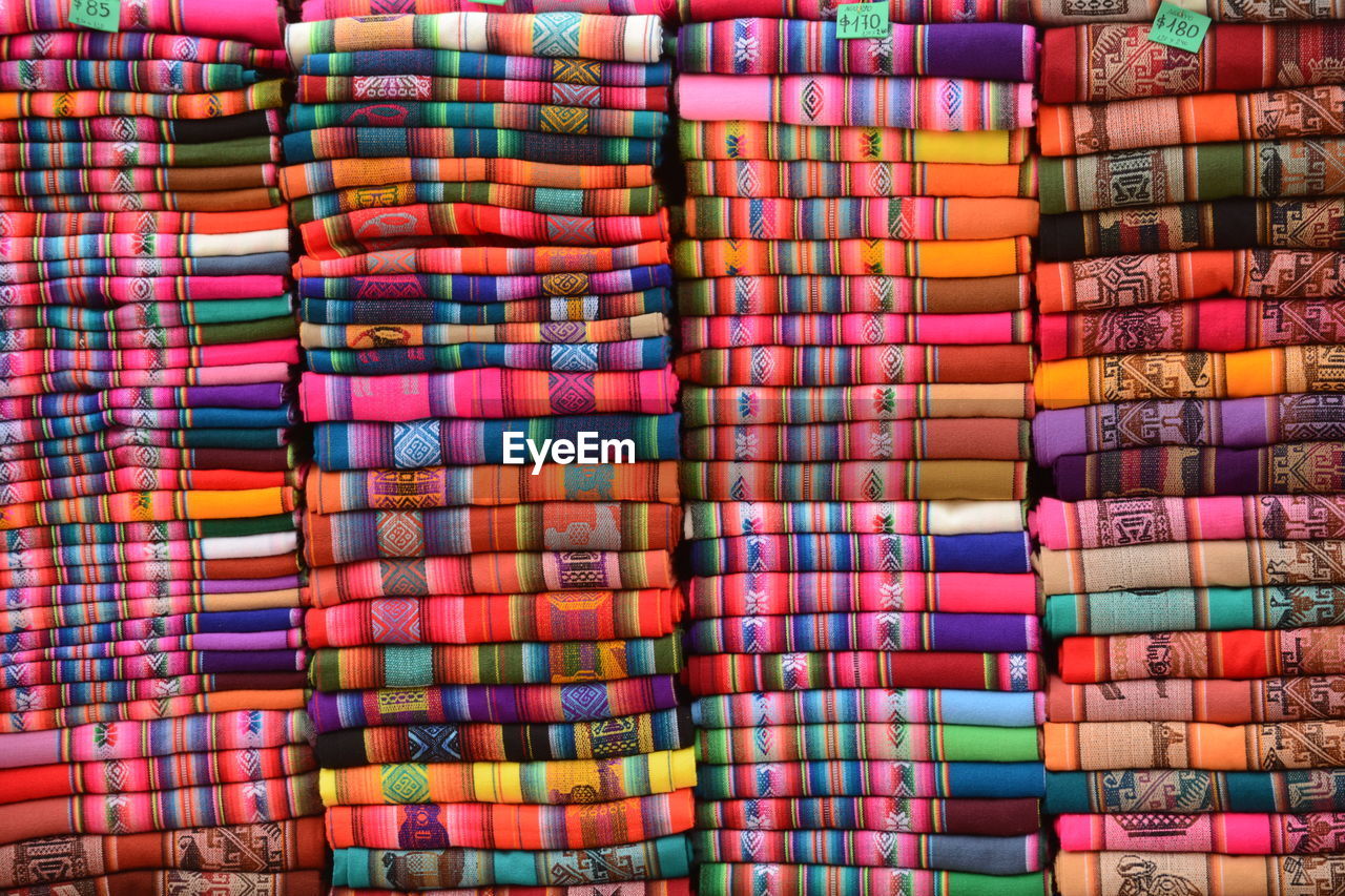Full frame shot of folded colorful fabrics in store