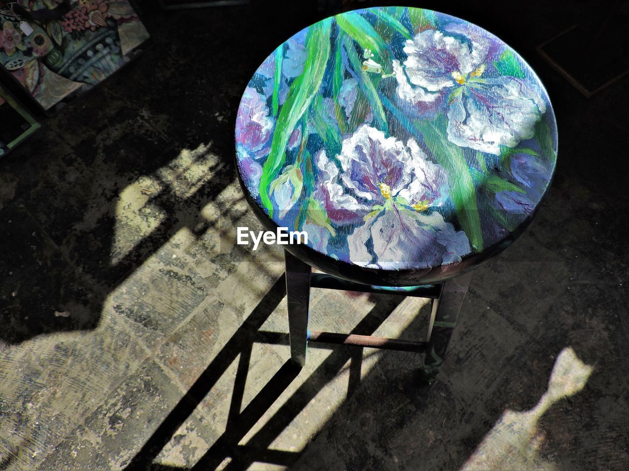 High angle view of empty painted stool on floor