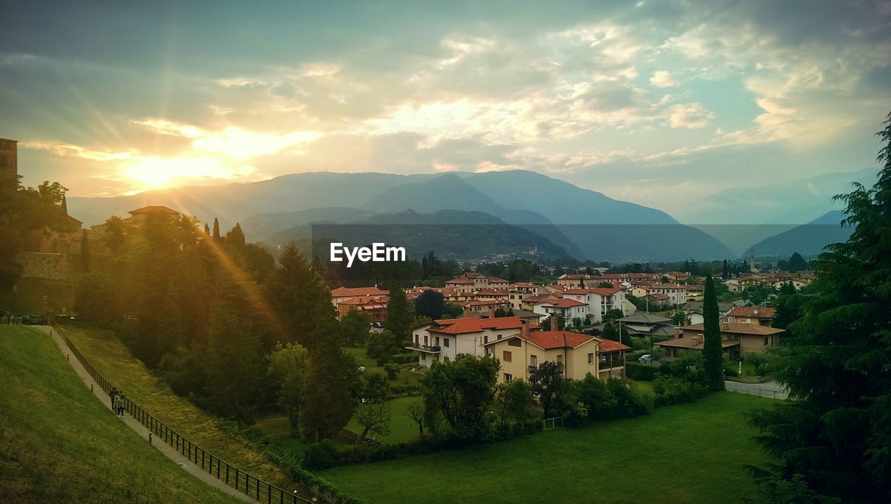 Sunset over mountains in front of a small village