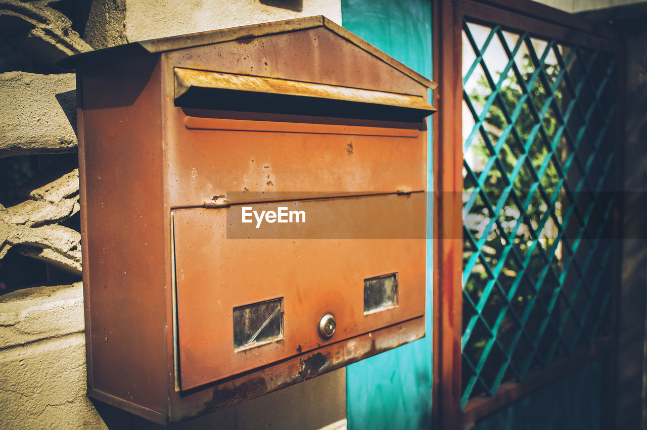 Close-up of mailbox on building wall