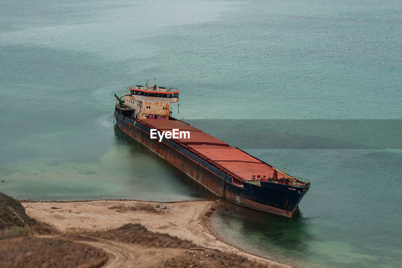 water, transportation, nautical vessel, sea, mode of transportation, nature, coast, vehicle, ship, high angle view, channel, no people, land, day, ocean, beach, outdoors, industry, watercraft, travel, bay, industrial ship, boat, oil tanker, scenics - nature