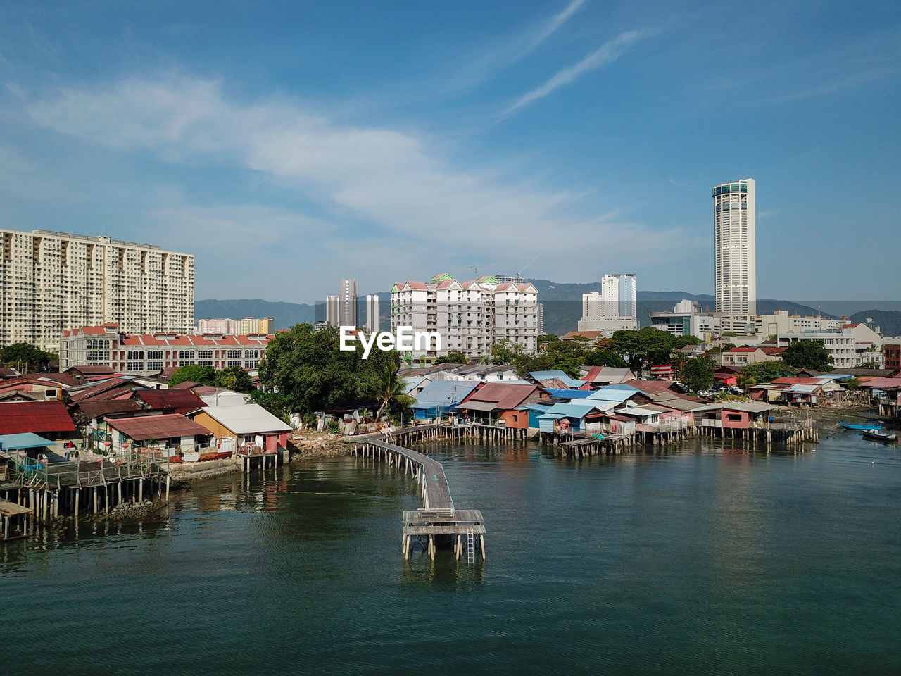 View of buildings against cloudy sky