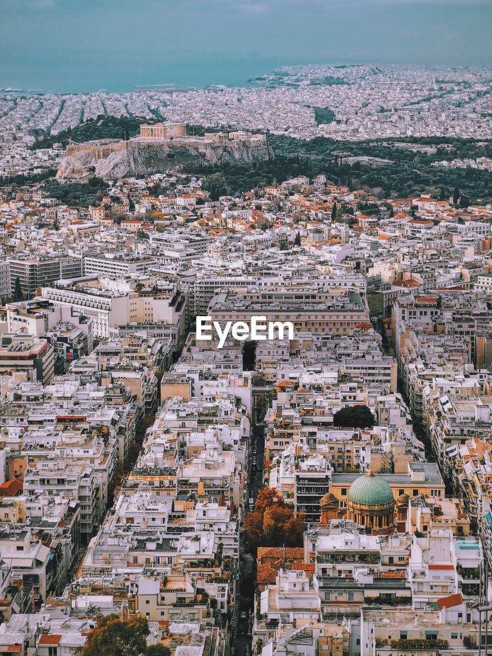 Urban athens with acropolis in the distance