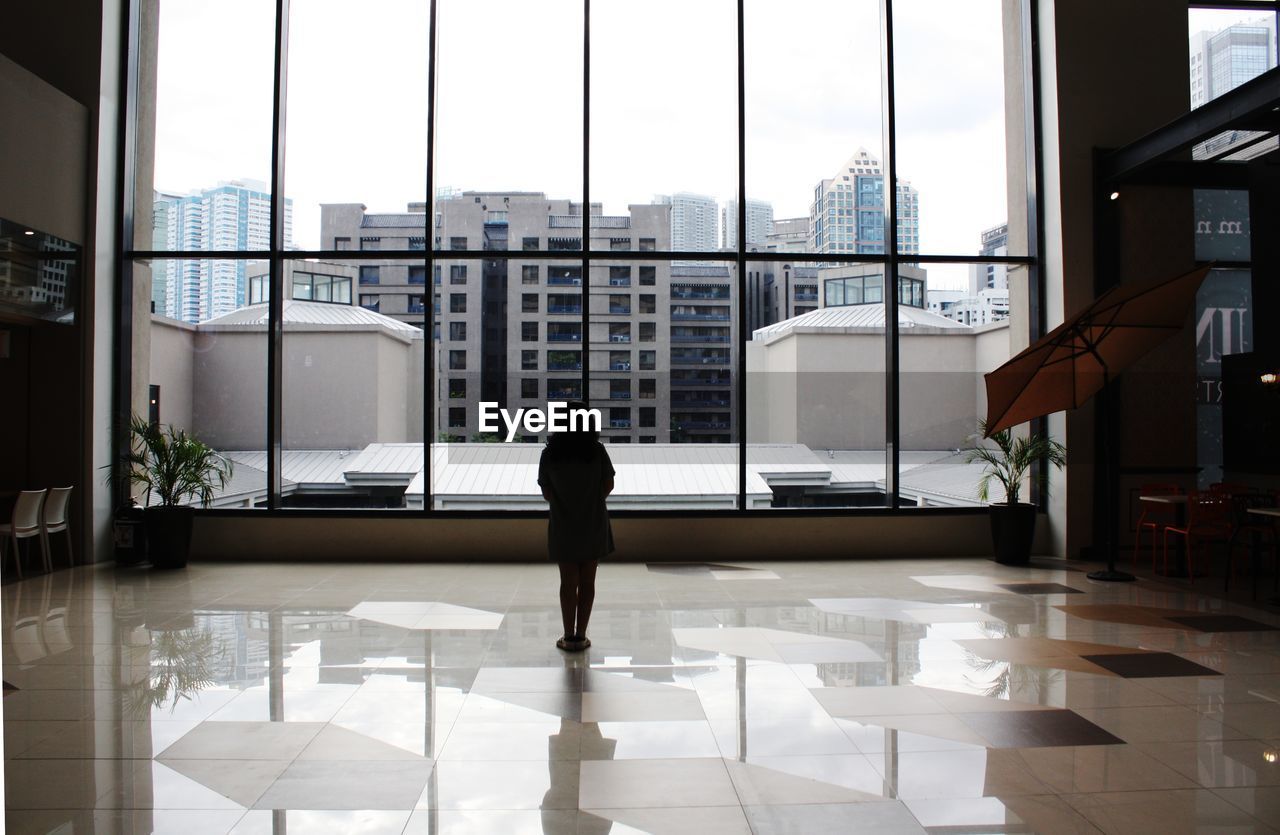 Woman standing in building