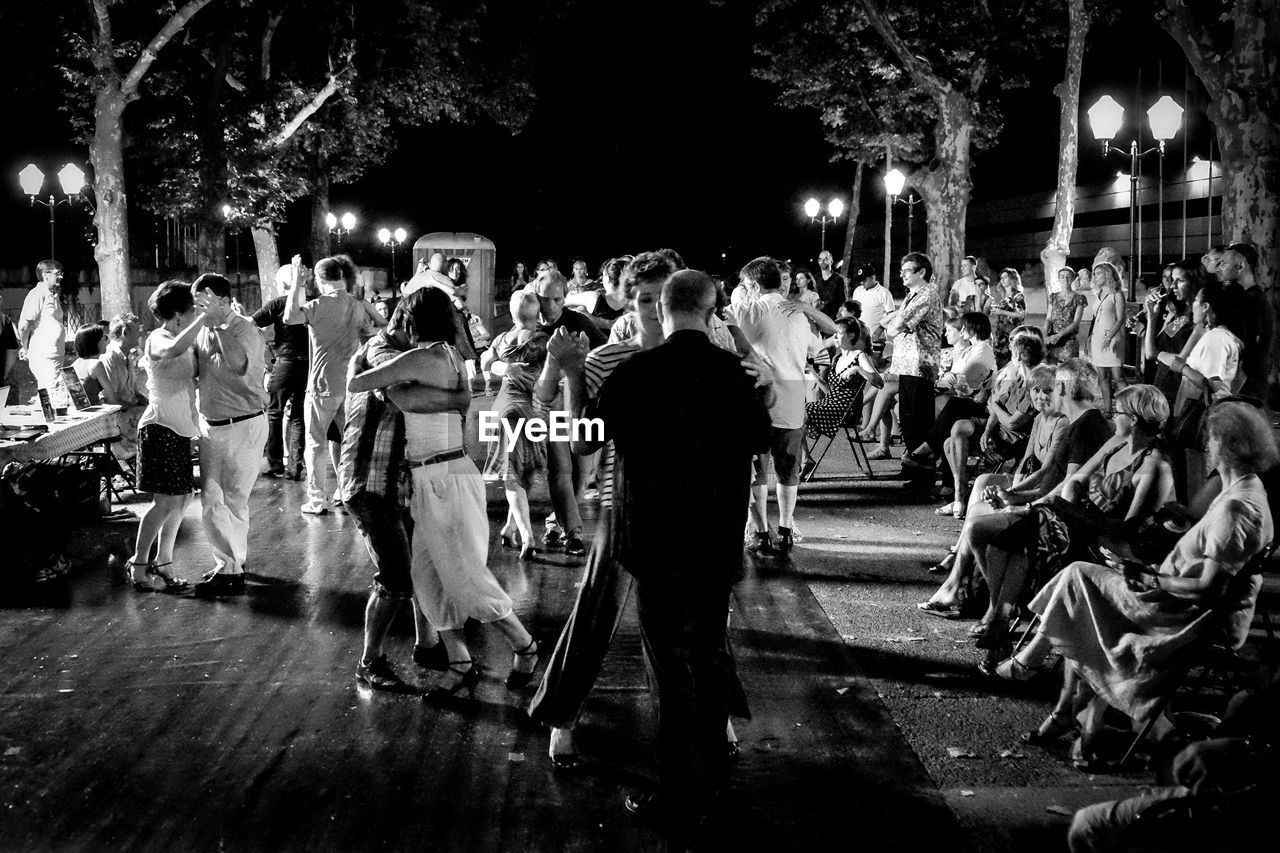 PEOPLE ENJOYING AT NIGHT