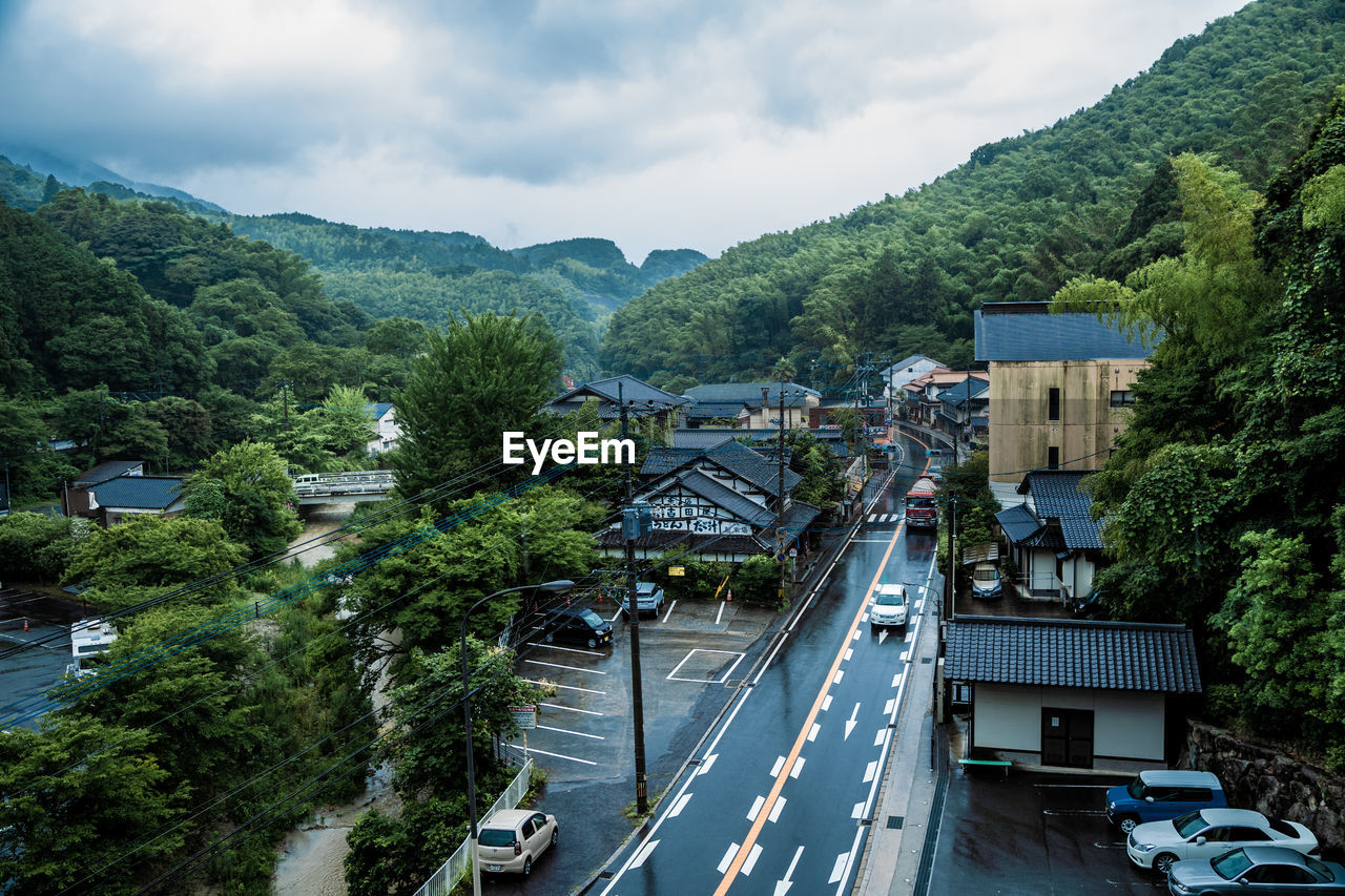 High angle view of cars on road against sky on a rainy day in fukuoka, japan