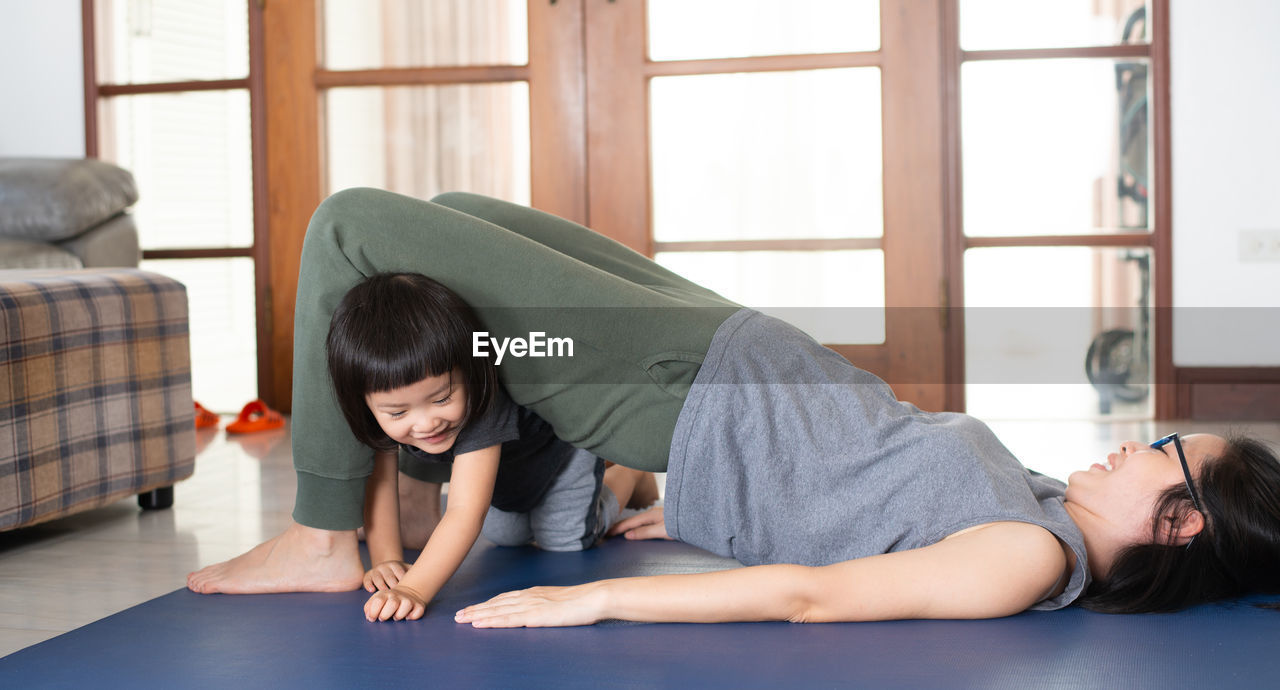 WOMEN LYING ON FLOOR