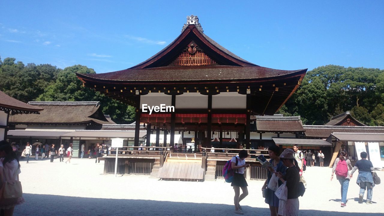 TOURISTS VISITING TEMPLE