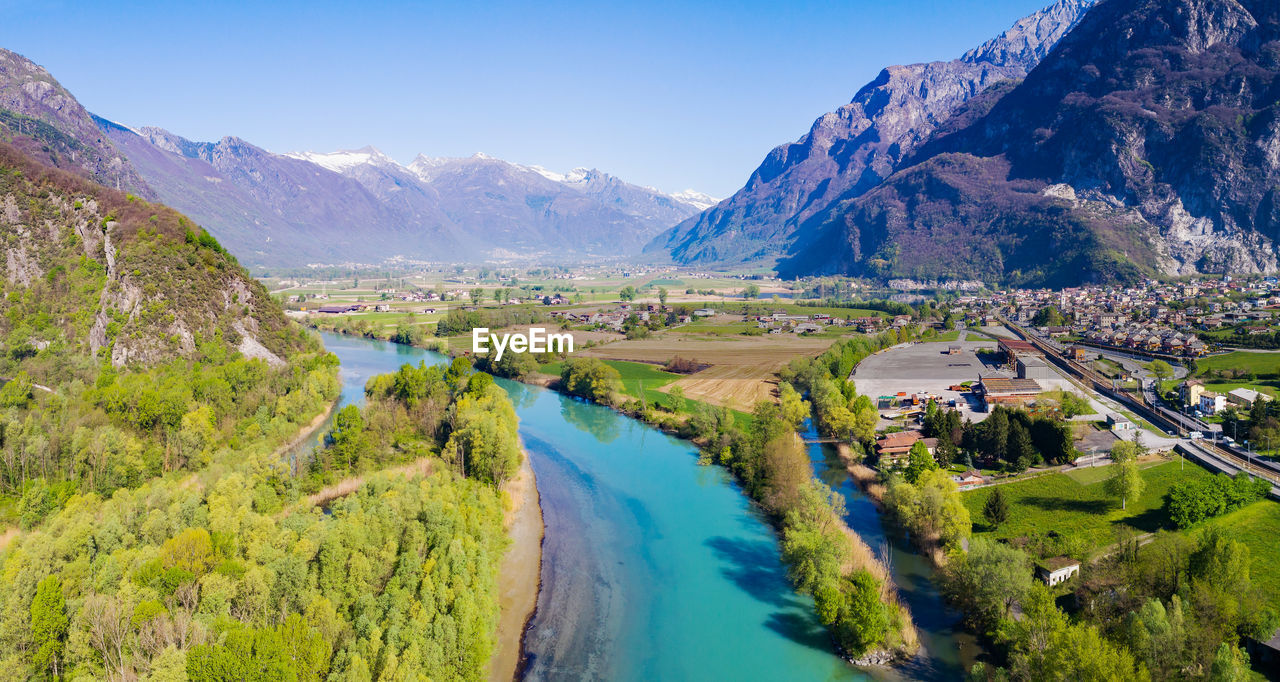 SCENIC VIEW OF LANDSCAPE AND MOUNTAINS AGAINST SKY