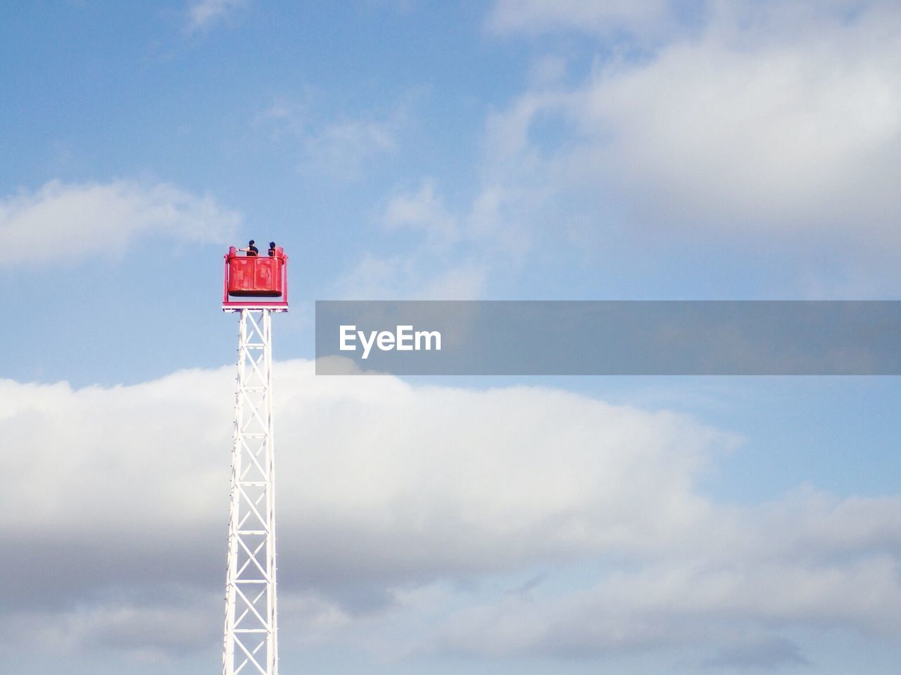 Low angle view of cherry picker against sky