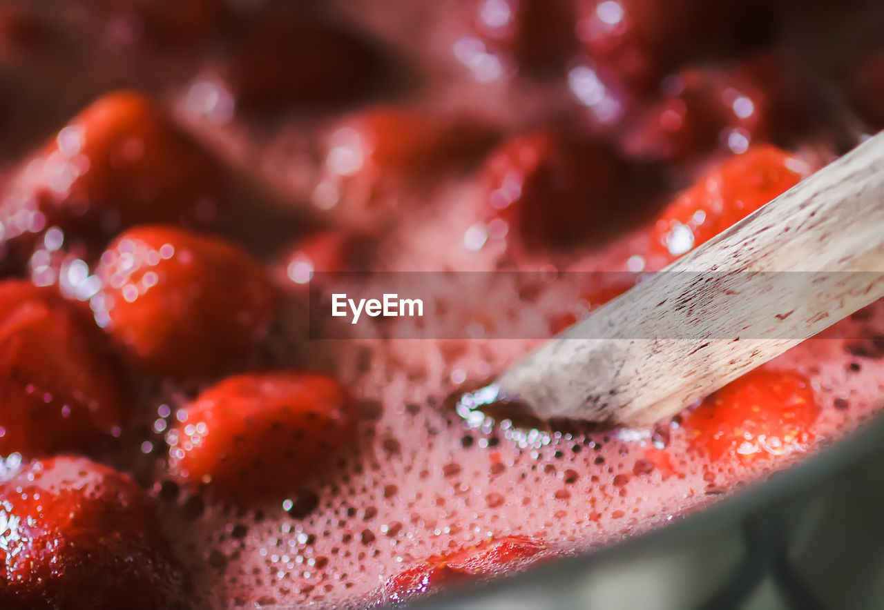 Strawberry jam oreparing process. berries are boiled in a saucepan