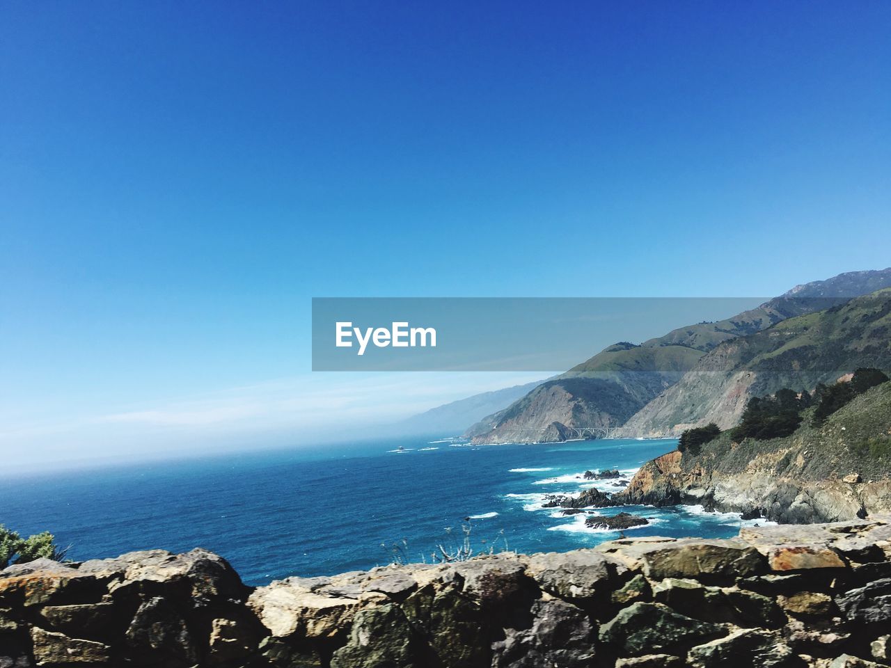 Scenic view of sea against blue sky