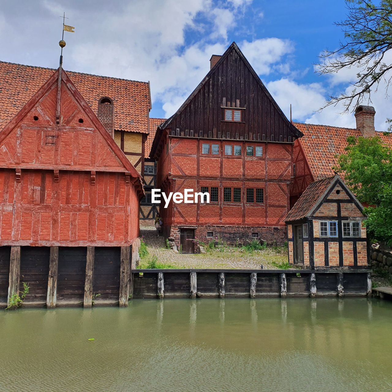 Historic buildings by river against