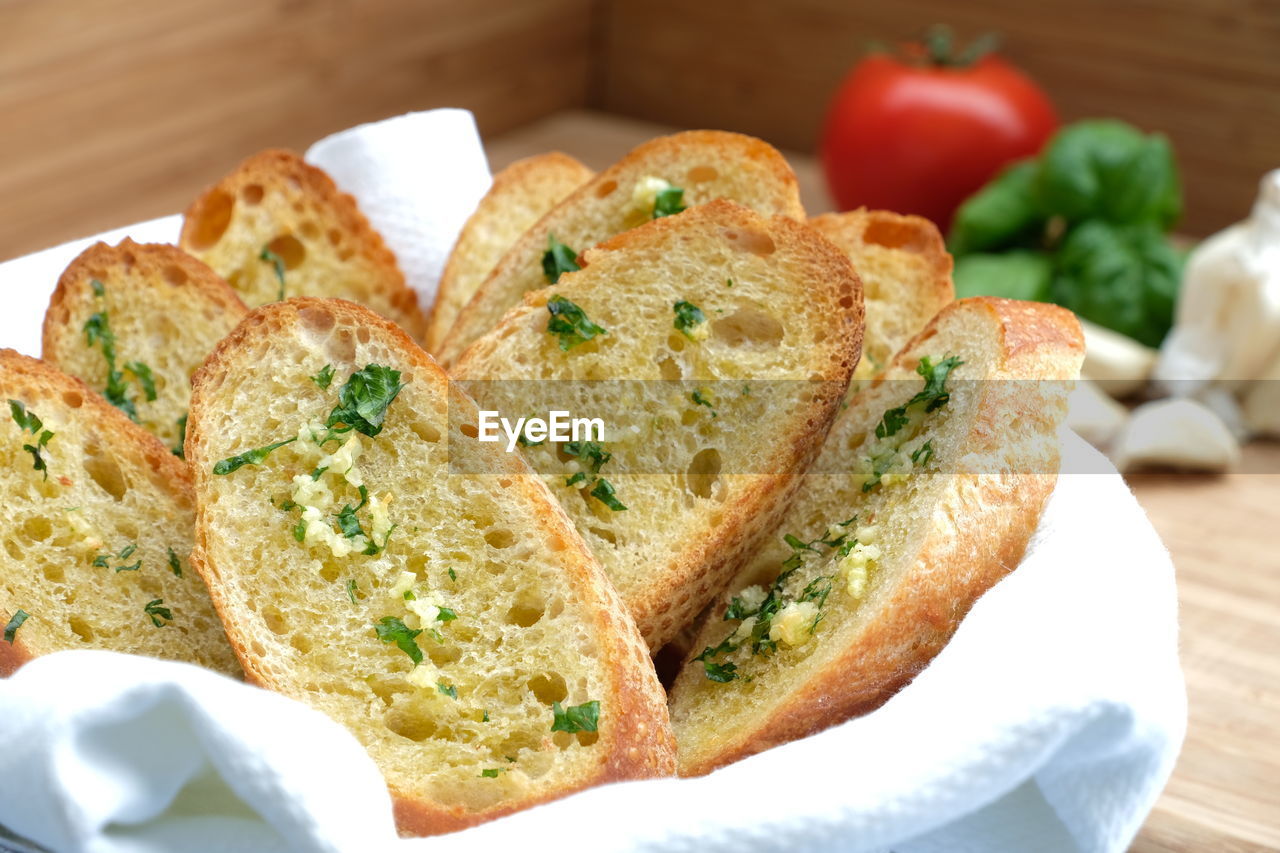 High angle view of garlic bread in container on table
