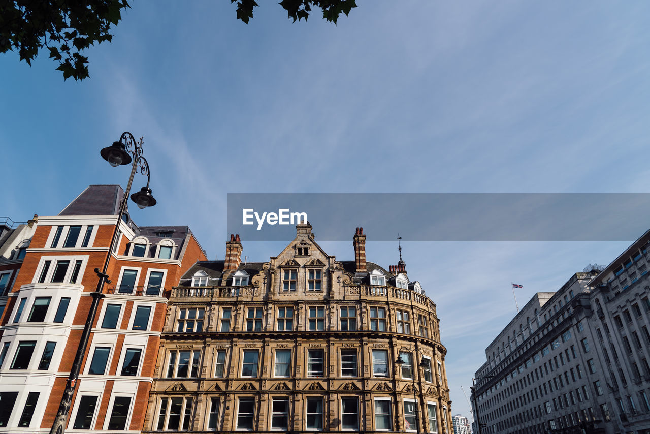 Old residential buildings in the city of london against blue sky.