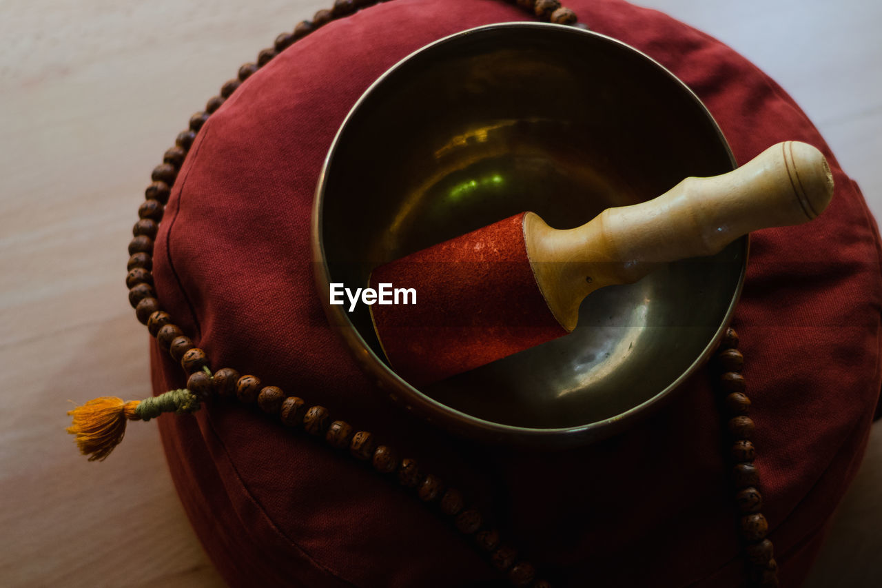 Tibetan bowl on a meditation cushion