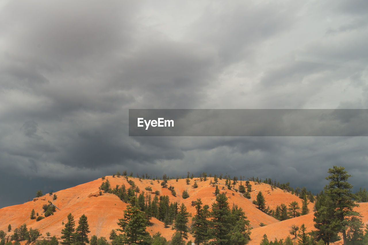 Scenic view of mountains against cloudy sky at dixie national forest
