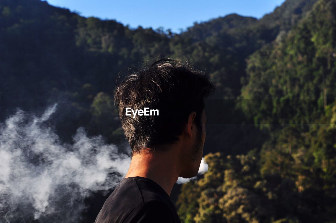 Close up of a young man in forest