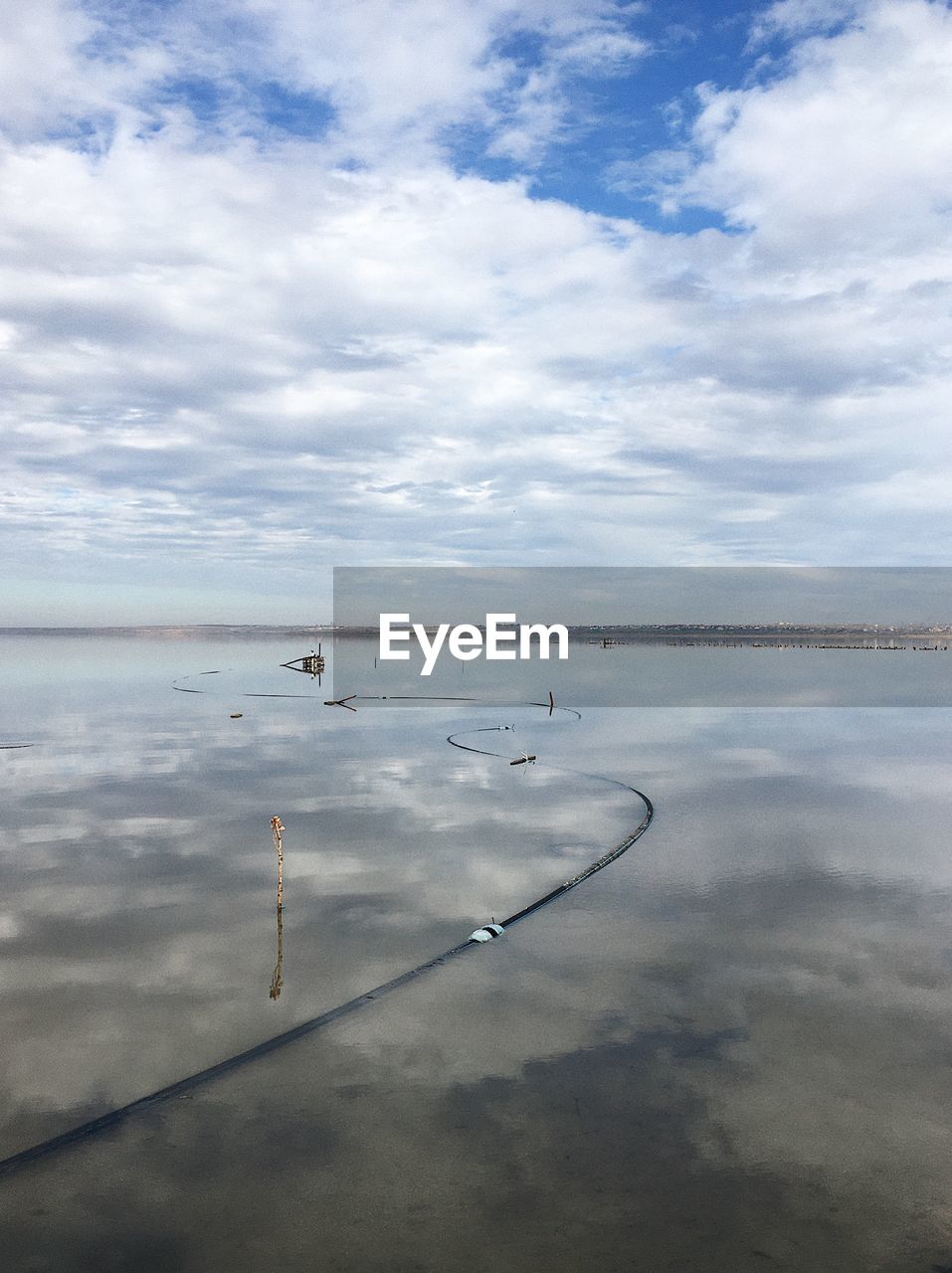 water, reflection, cloud, sky, sea, horizon, nature, tranquility, scenics - nature, beauty in nature, shore, day, tranquil scene, no people, ocean, outdoors, wave, coast, body of water, beach, horizon over water, environment, land, morning, non-urban scene, idyllic