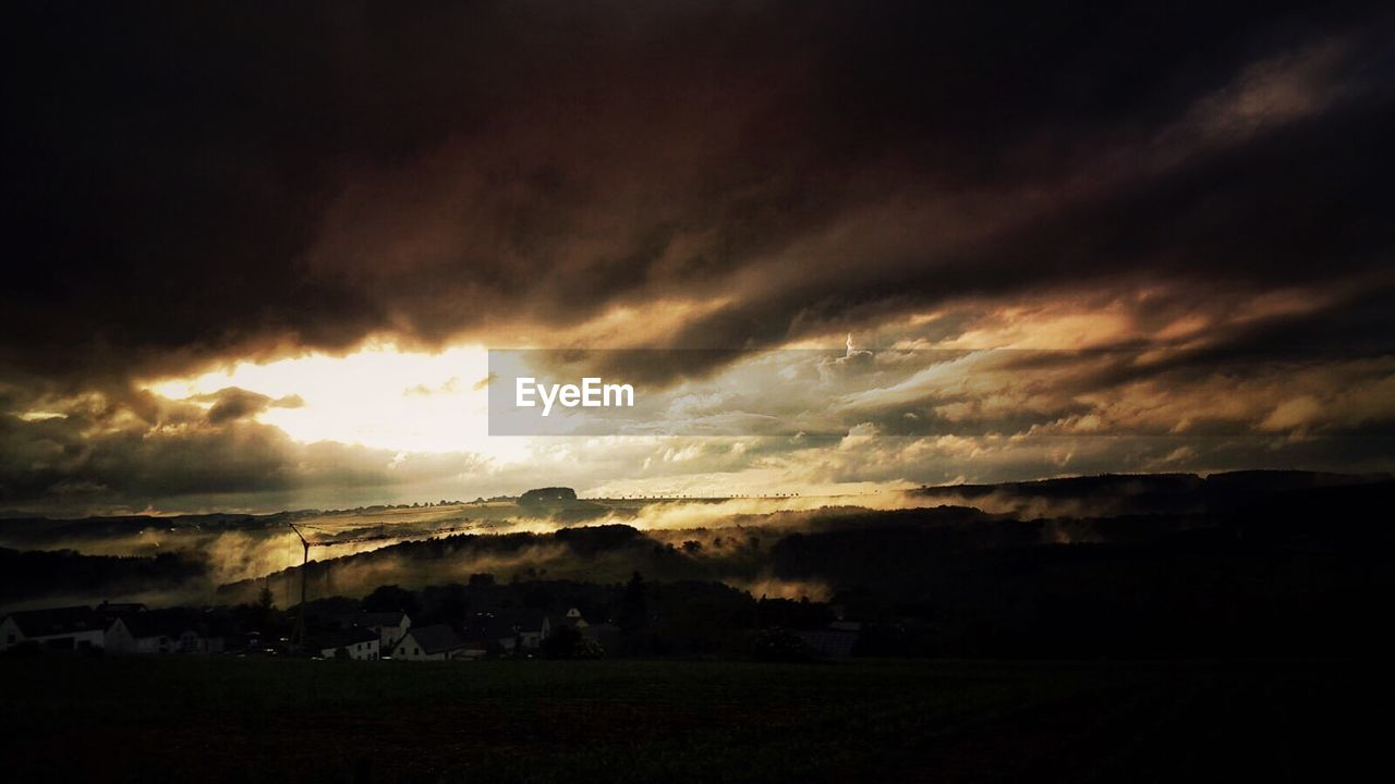 STORM CLOUDS OVER LANDSCAPE