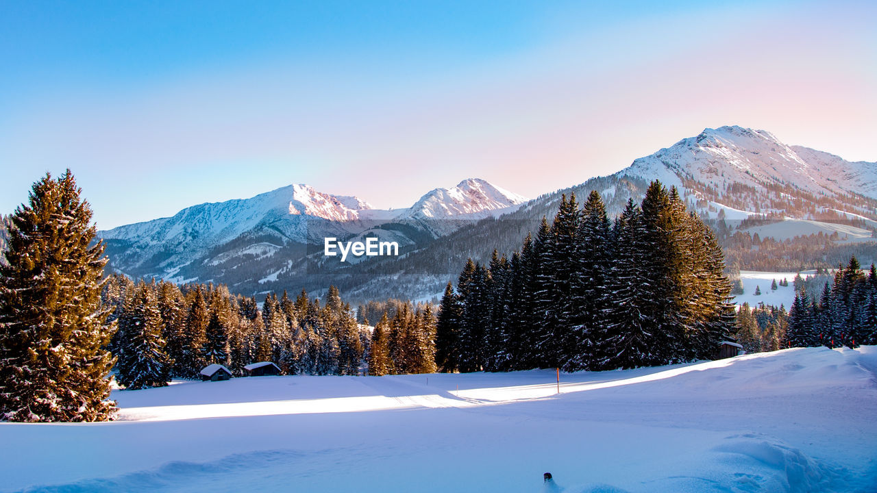 Scenic view of mountains against sky during winter