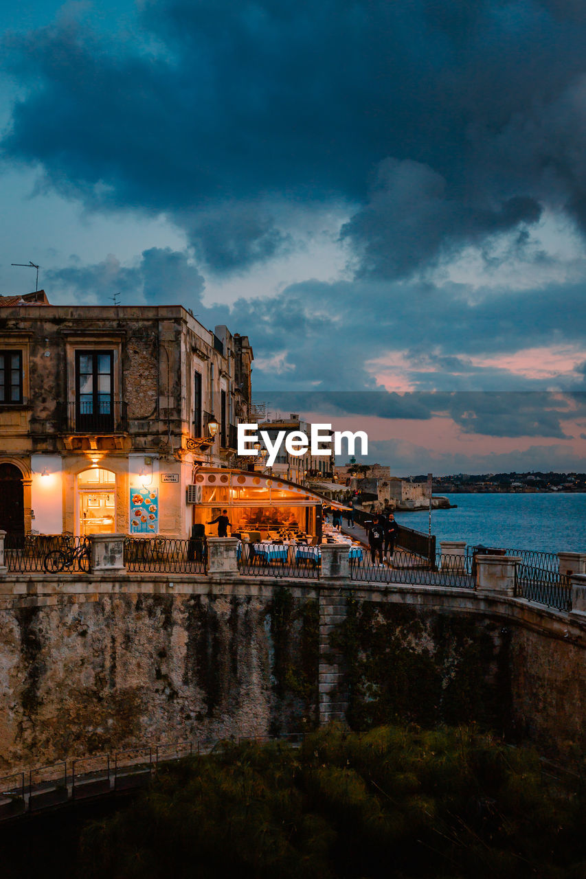 Panoramic view of ortigia with fonte aretusa and lungomare alfeo  during sunset