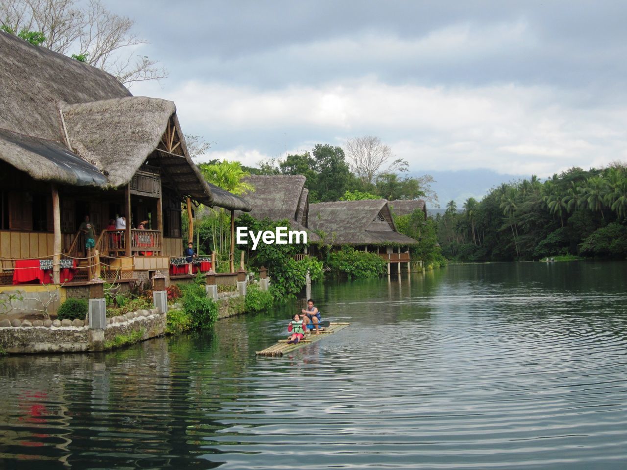 SCENIC VIEW OF LAKE BY BUILDING