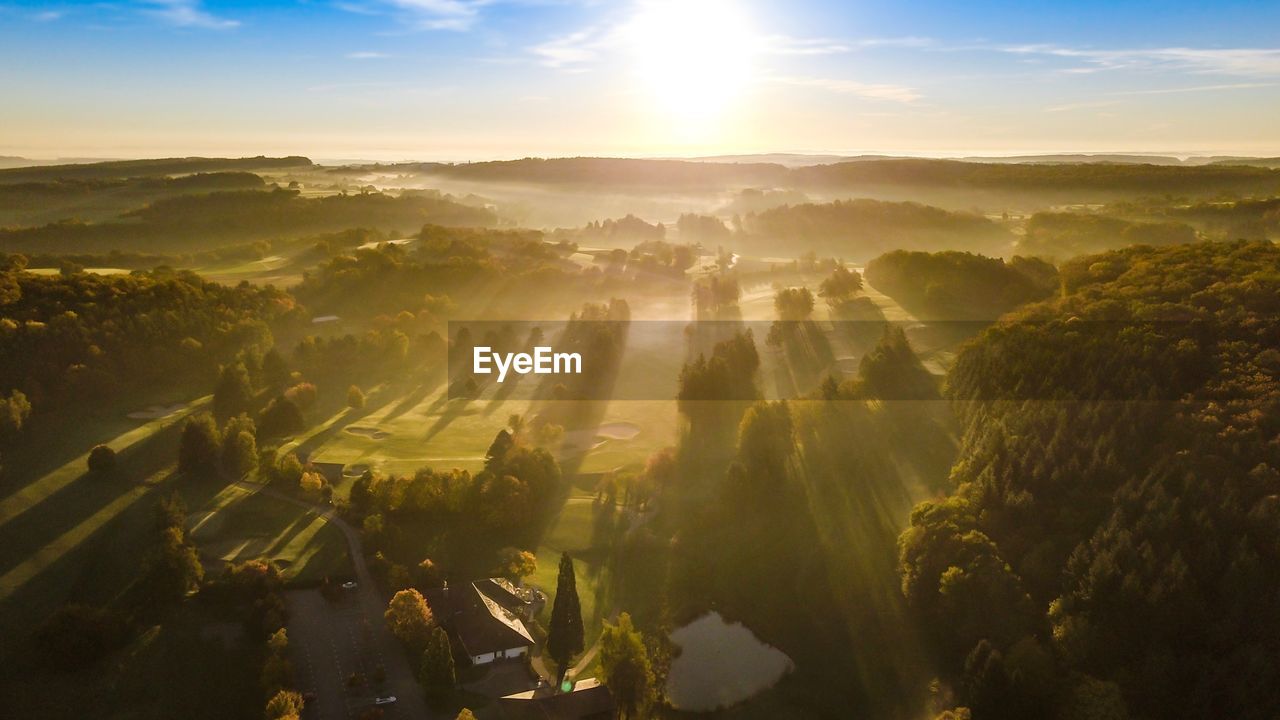 Aerial view of landscape against sky during sunset