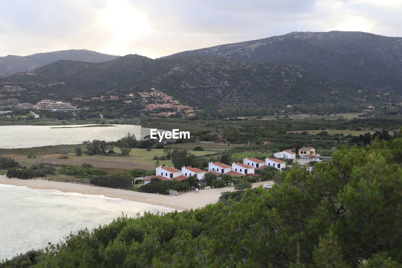 High angle view of townscape and mountains against sky