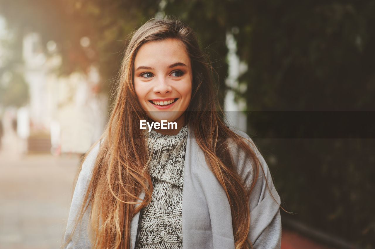 Young woman standing in city