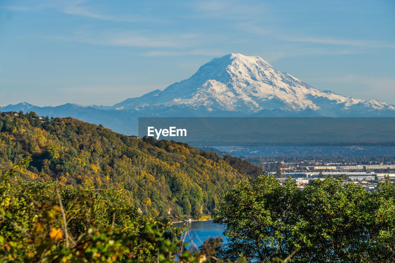 A view of mount rainier and the port of tacoma.