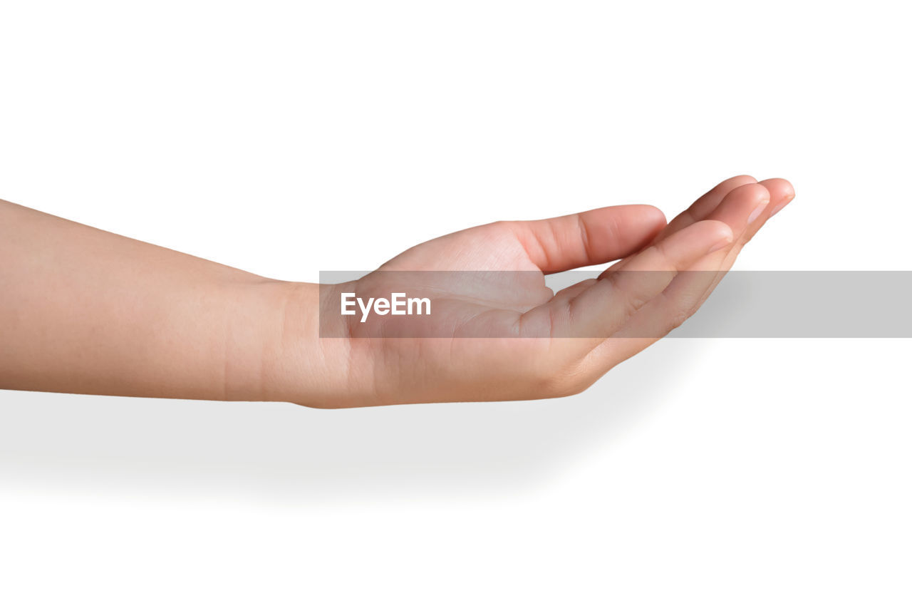 CLOSE-UP OF HANDS HOLDING WHITE BACKGROUND