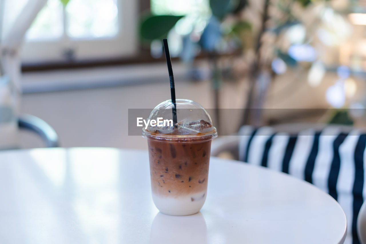 CLOSE-UP OF COFFEE IN GLASS