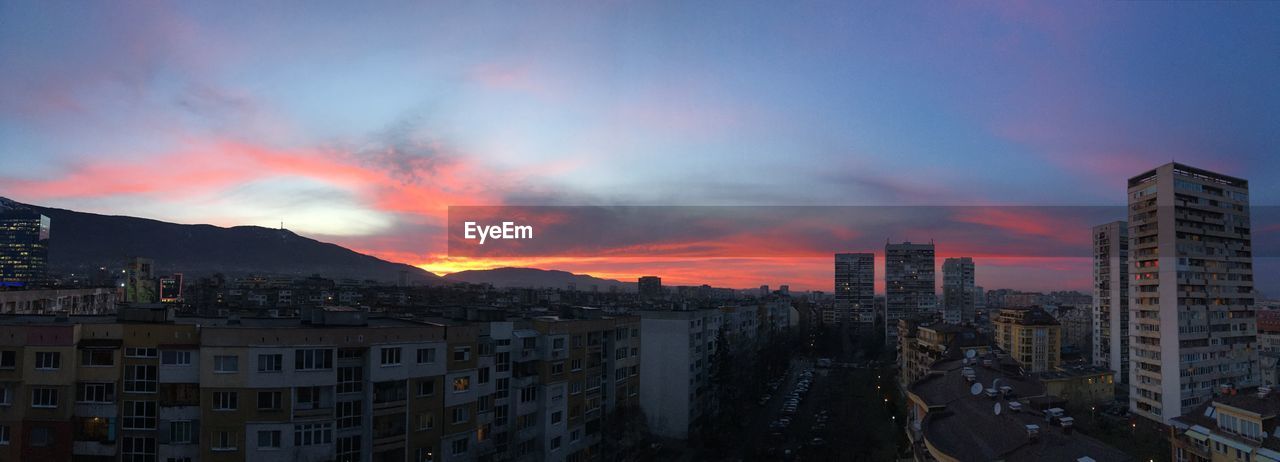 CITYSCAPE AGAINST SKY DURING SUNSET