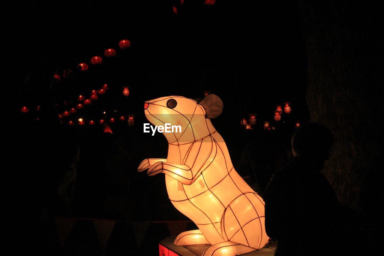Illuminated rat decoration at night