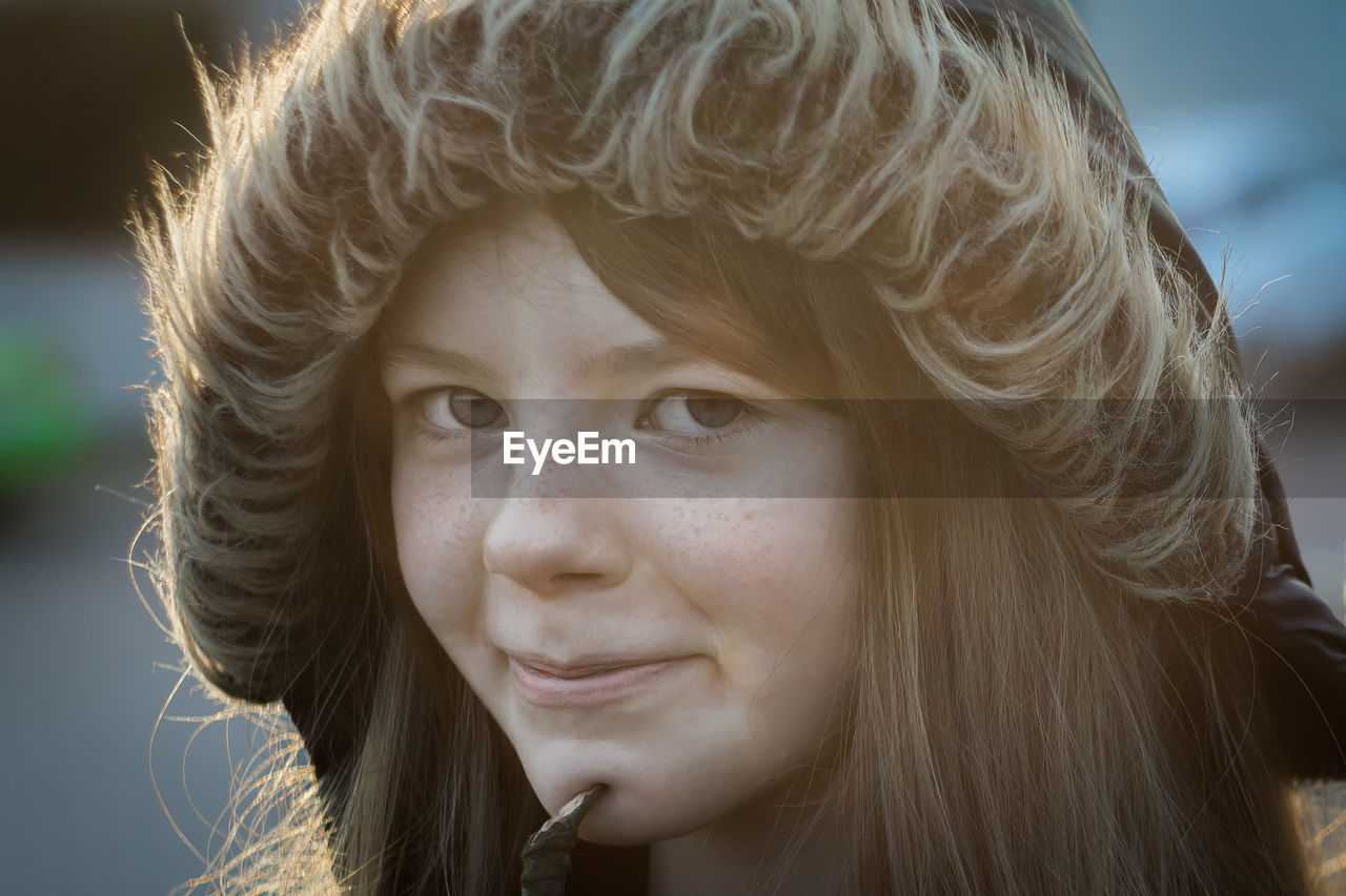 Close-up portrait of girl wearing hooded jacket