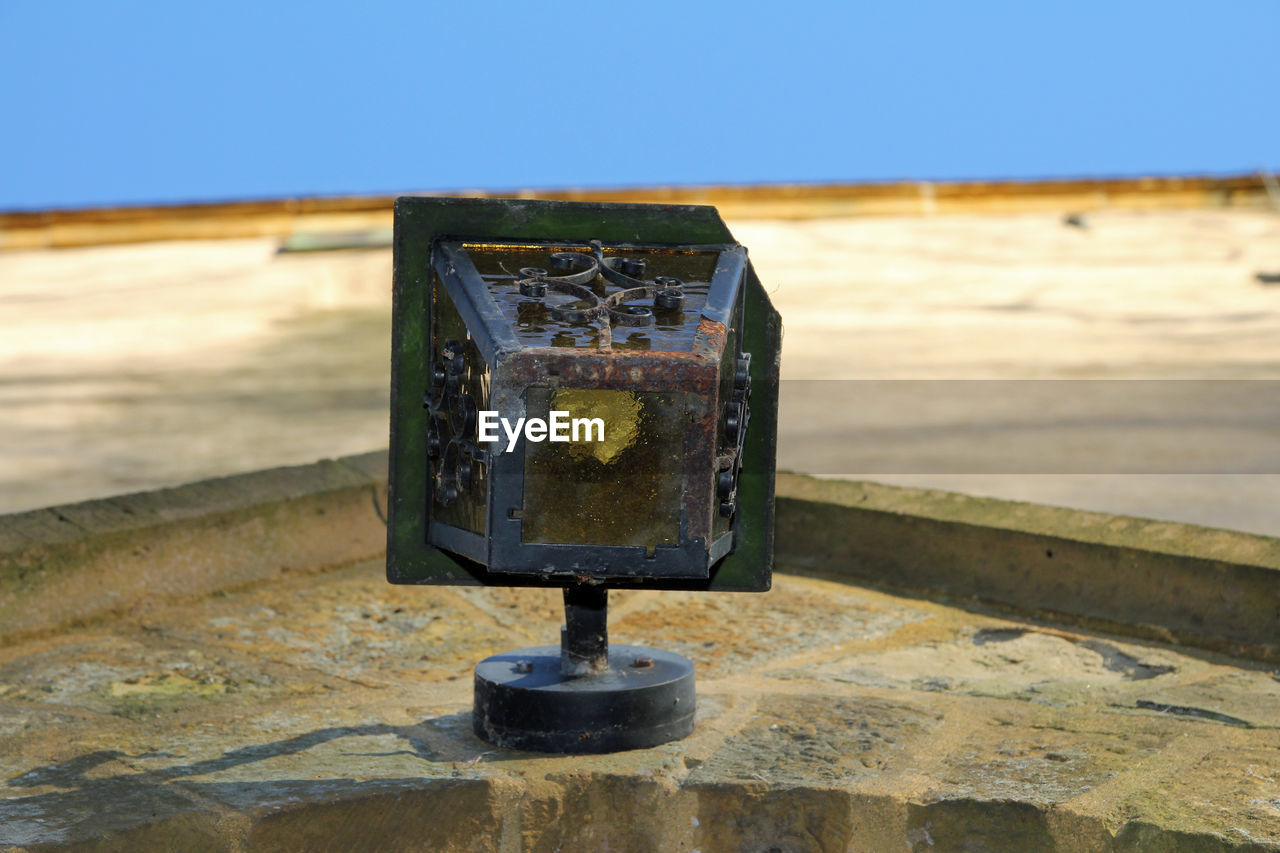 Close-up of rusty metal lamp